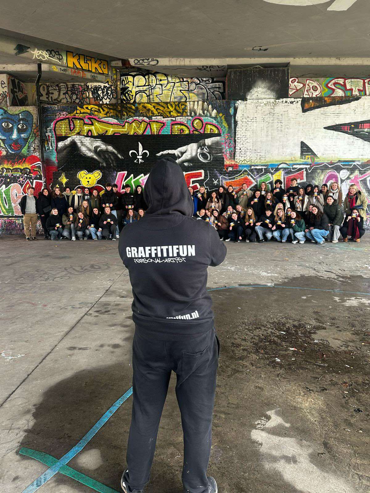 Group painting during a professional graffiti workshop