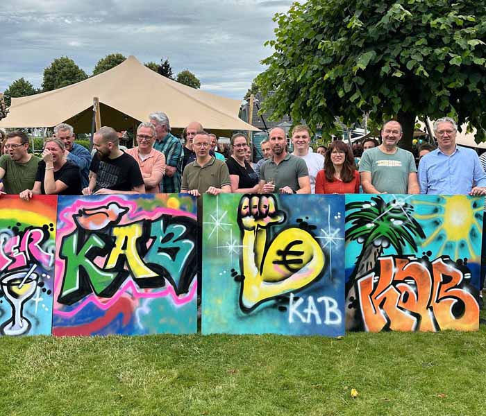 Corporate team enjoying a graffiti workshop together